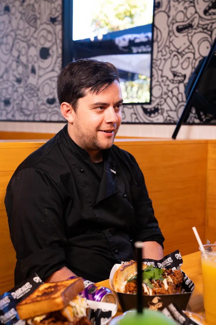 Chef seated with dishes at Grandalfs